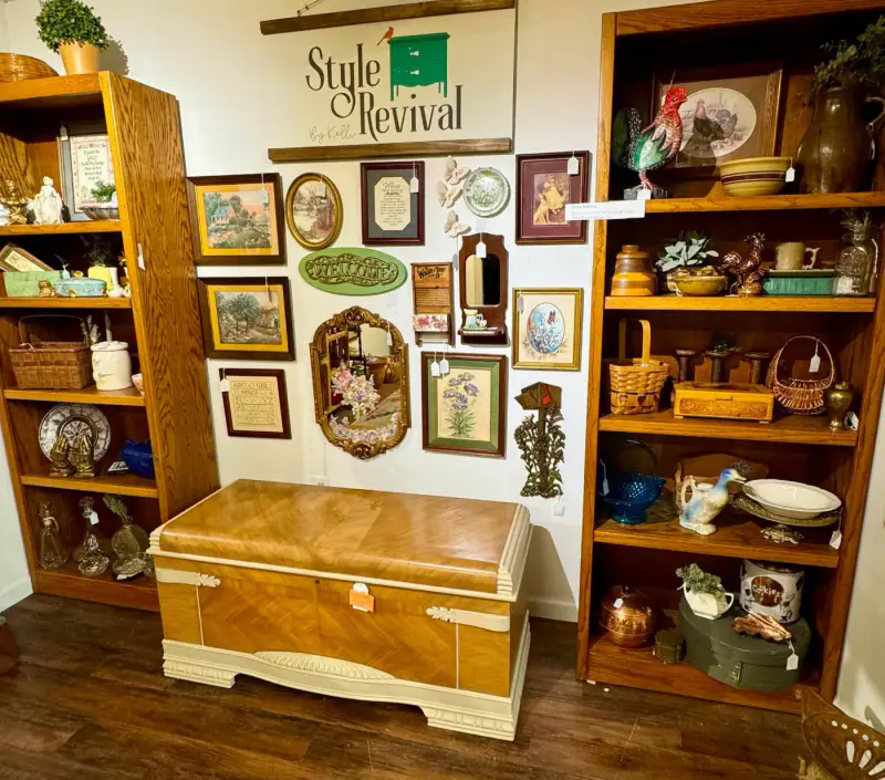 The waterfall cedar chest under the Style Revival sign, between shelves of finds