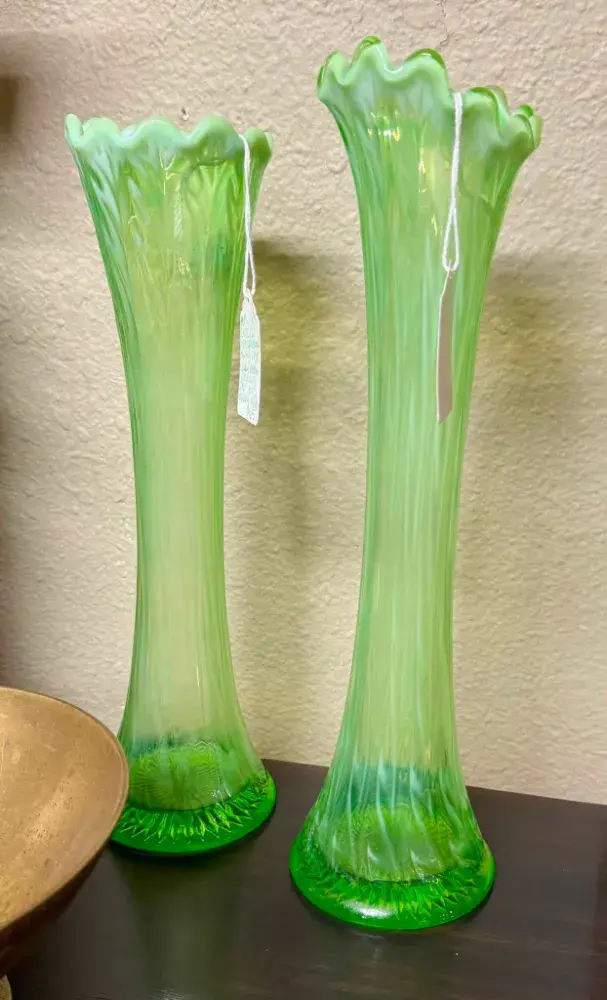 Pair of tall fluted green glass swung vases