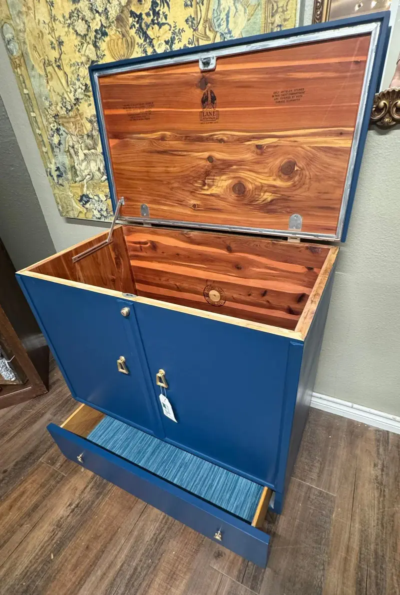 Inside: the lift top opens to solid cedar, and the drawer is lined in stripes