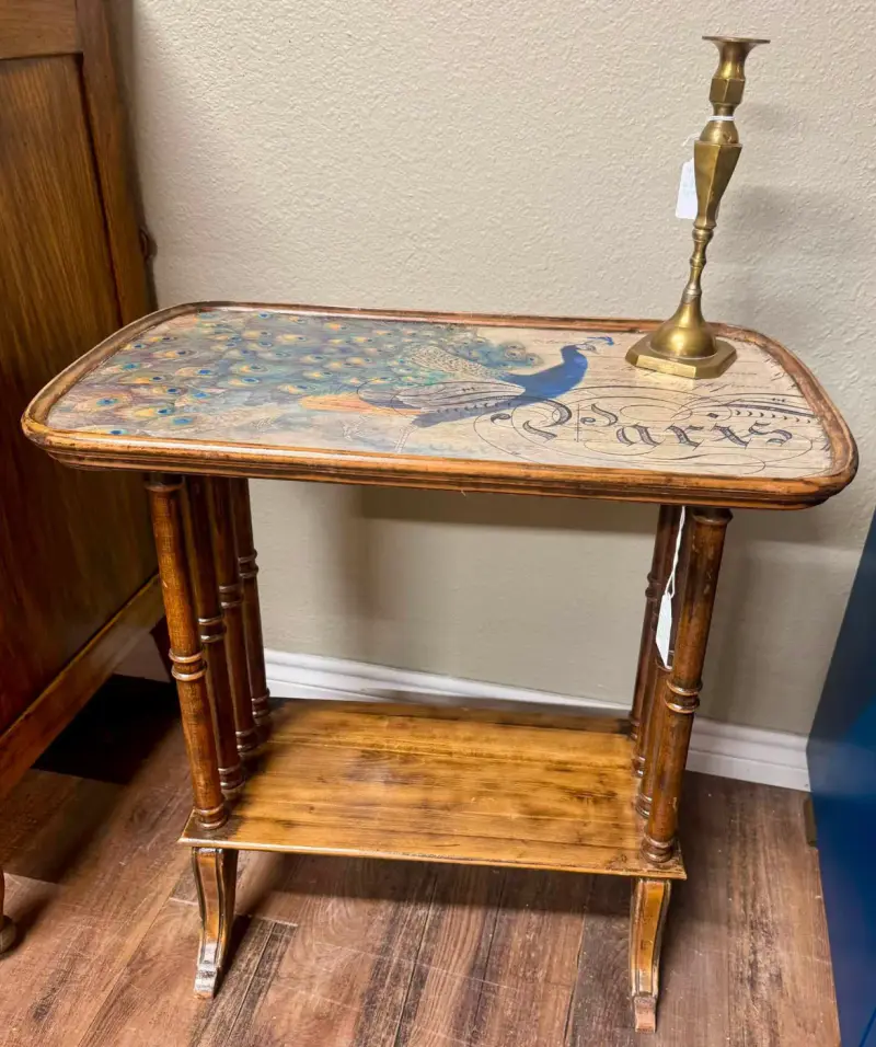 Side table with a peacock and Paris script decoupaged on the top, spindle legs and a lower shelf