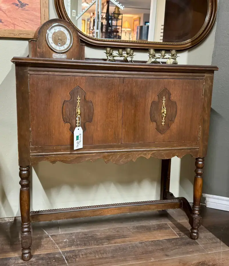 Vintage walnut server with carved door medallions and turned legs