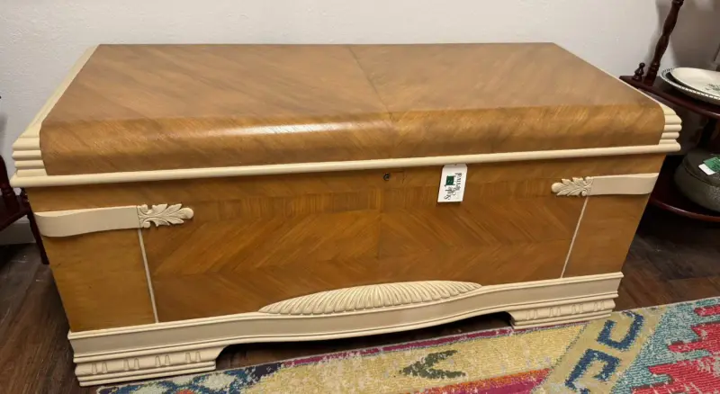 Art deco waterfall cedar chest with matched veneer and cream trim